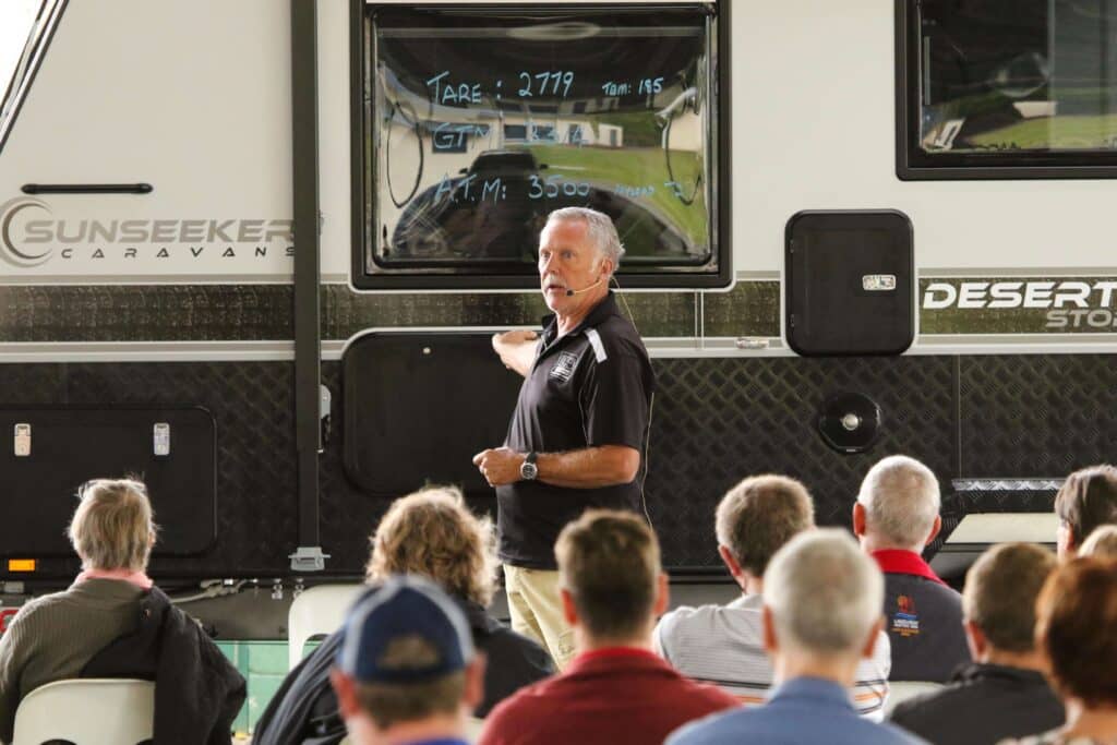 Man explaining caravan weights to an audience